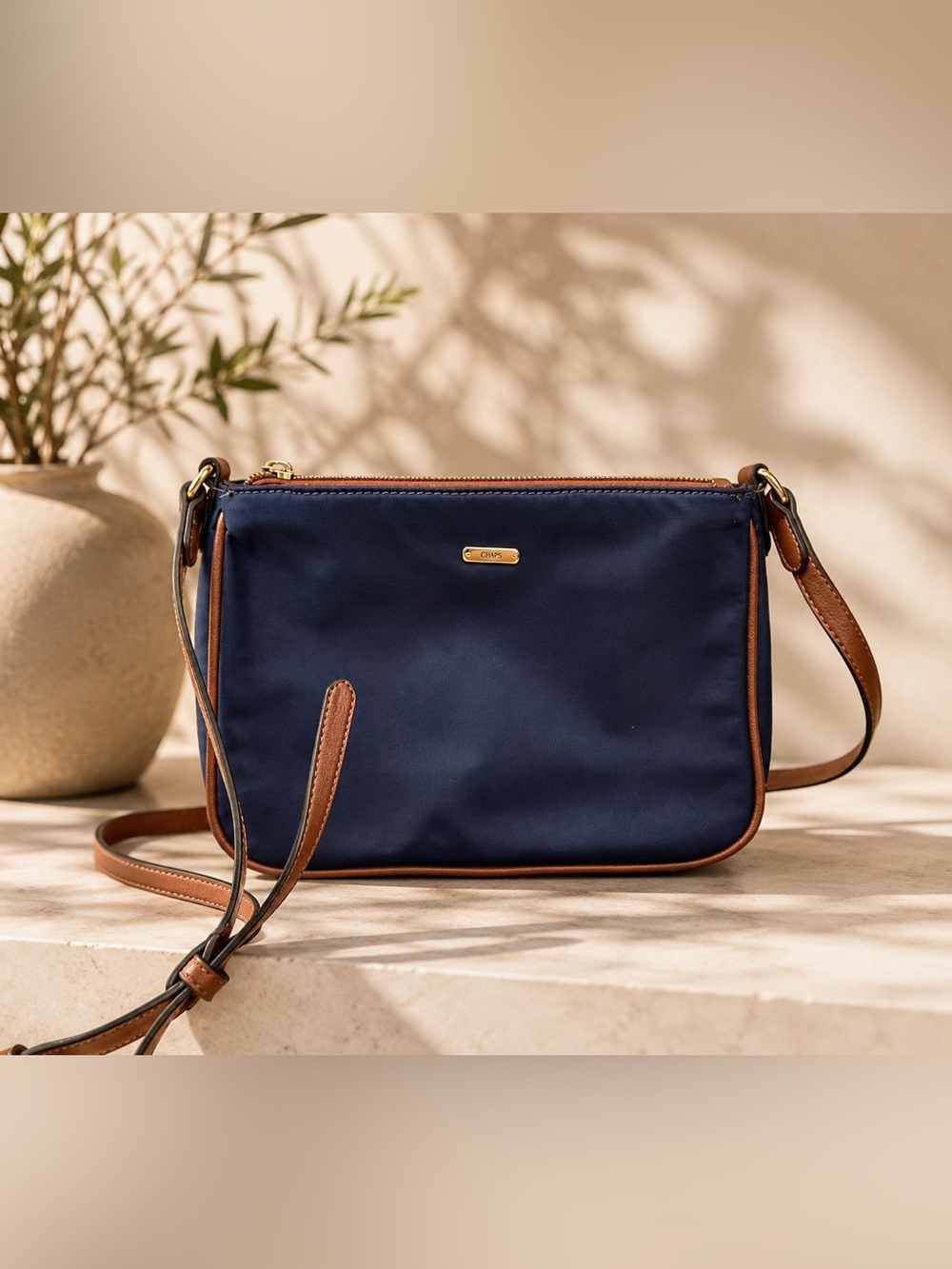 Chaps Navy Crossbody with Brown Trim and Gold Logo
